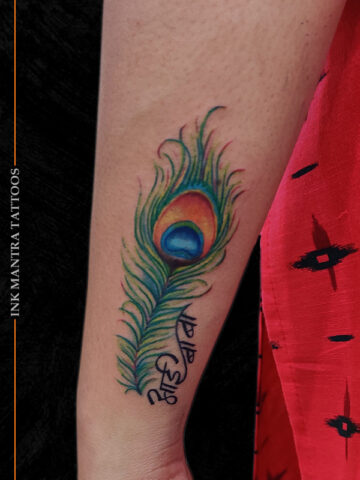 Aai Baba And Peacock Feather Tattoo By Ink Mantra Tattoos Pune - Ink Mantra Tattoo Studio
